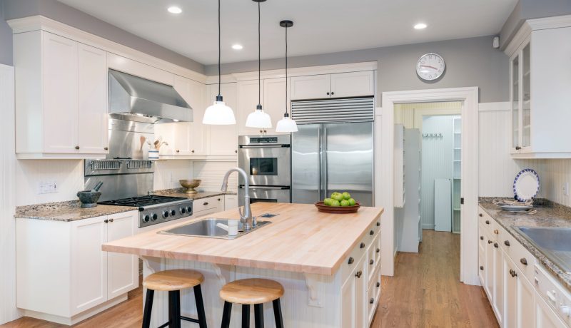 Luxury Kitchen Interior in white with wooden floor and kitchen i